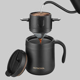 Black coffee maker with a mug, coffee beans, and leaves on a white background