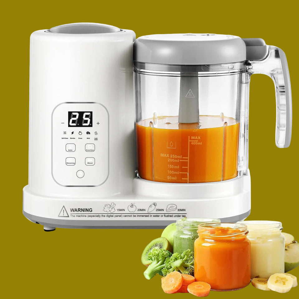 White baby food maker with a glass container filled with orange juice, surrounded by vegetables and jars of baby food.
