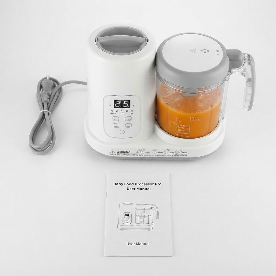 A white and gray baby food processor with a clear container filled with orange puree, shown on a white background with its power cord and a user manual in front.