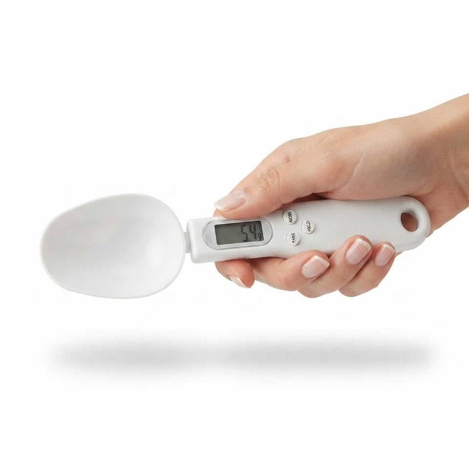 Hand holding digital kitchen measuring spoon scale with LCD display