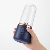 Hand holding portable USB rechargeable personal blender