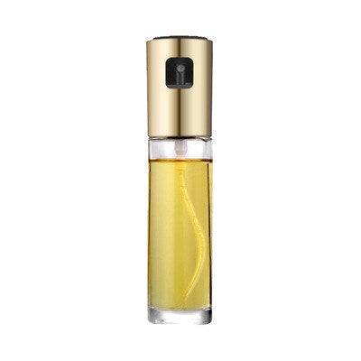 Gold and clear cosmetic bottle with yellow liquid on a white background