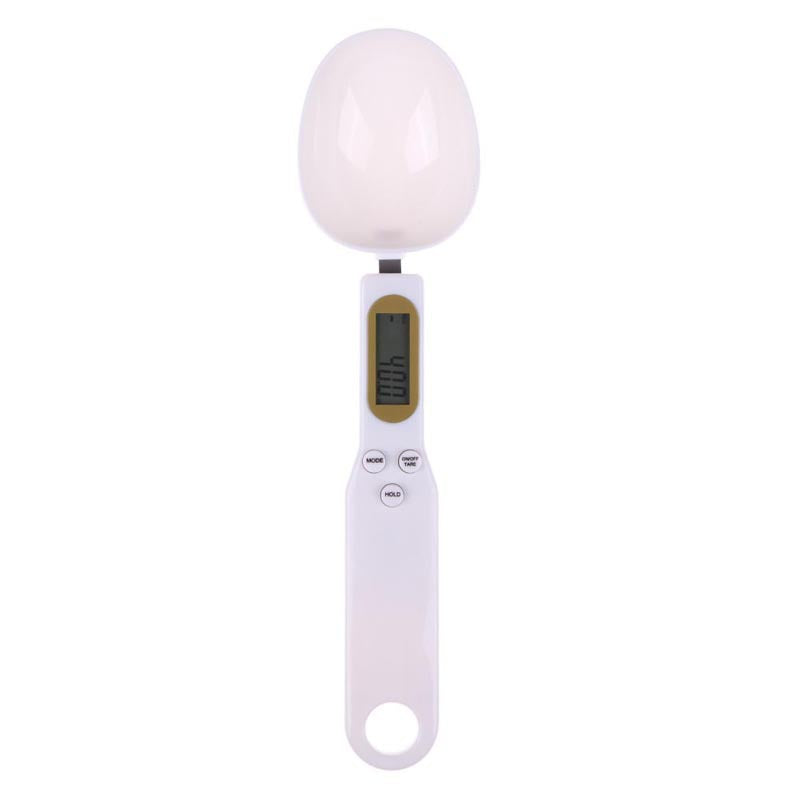 Digital kitchen scale with a white bowl on a white background