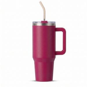 A matte magenta pink insulated travel tumbler with a handle, clear lid, and beige straw, shown on a clean white background.