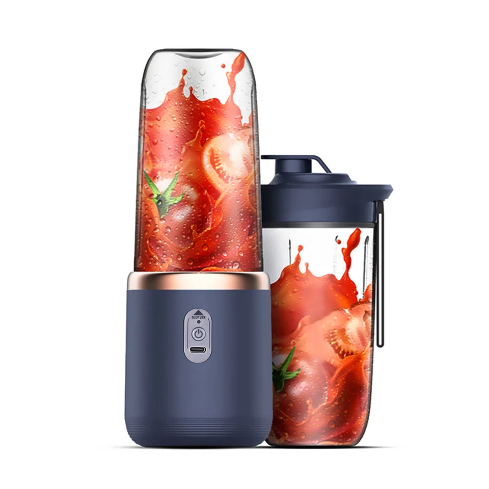 Navy blue portable blender with a clear container showing red juice and green leaves on a white background